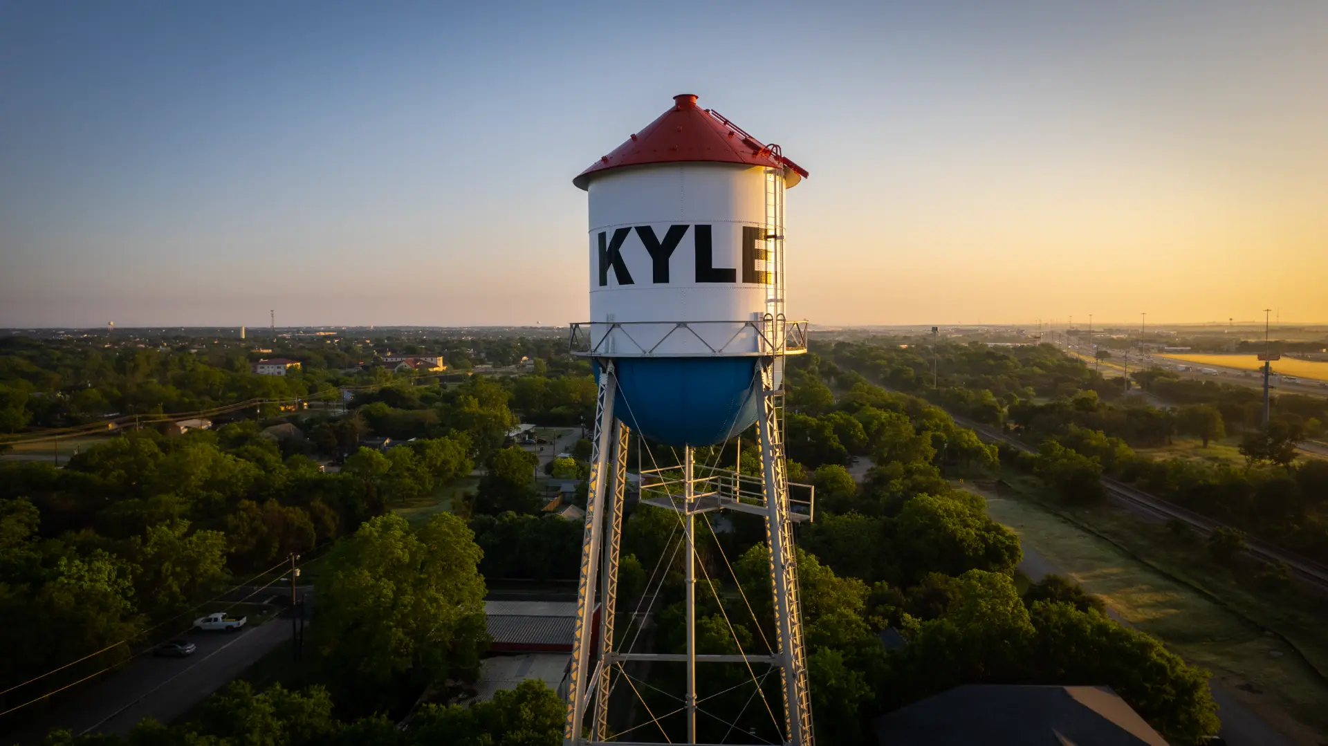 Kyle, Texas water tower at sunrise with the town name visible